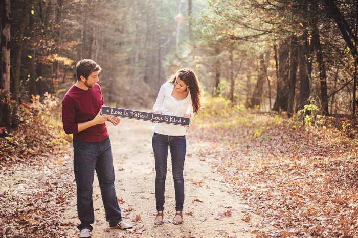 engagement session in the woods, surrounding a fire with smores and flannel in autumn