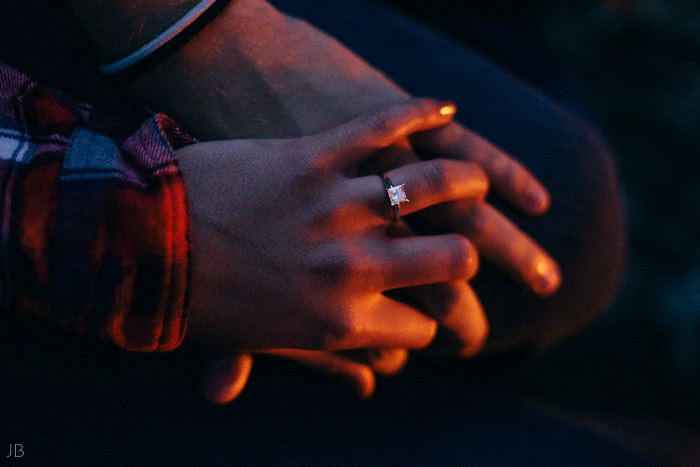 engagement session in the woods, surrounding a fire with smores and flannel in autumn