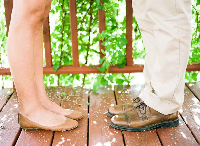 enjoying lemonade on porch under a vine summer engagement session shot on Fuji 400H