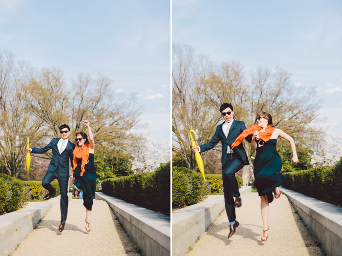 couple kissing in the cherry blossoms in Washington DC on the Tidal Basin