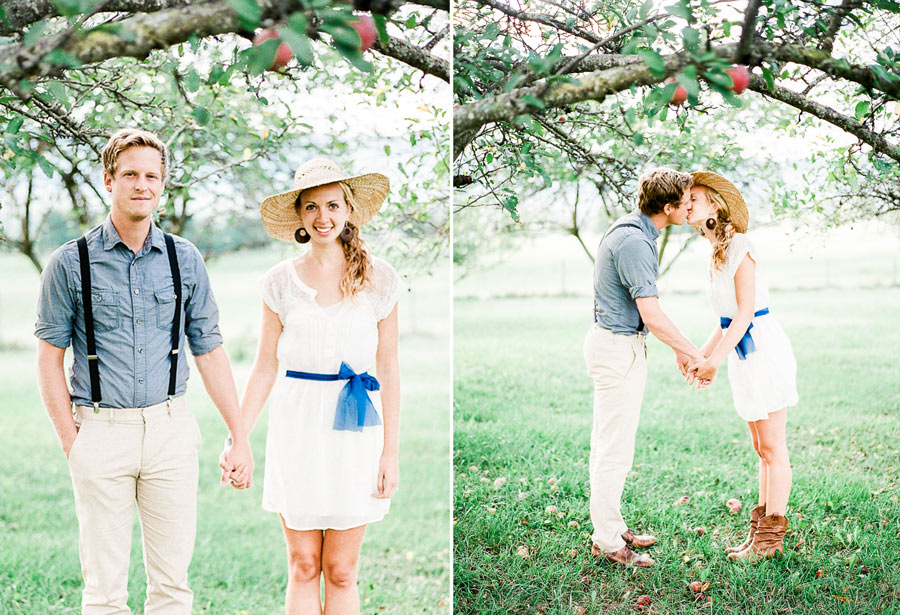 dreamy vintage engagement in an orchard kiss behind vintage straw hat camera color film fuji400h medium format vibrant