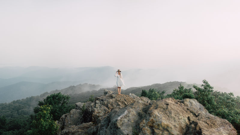 free spirit mountain bridal portraits session at sunrise with foraged wildflower bouquet