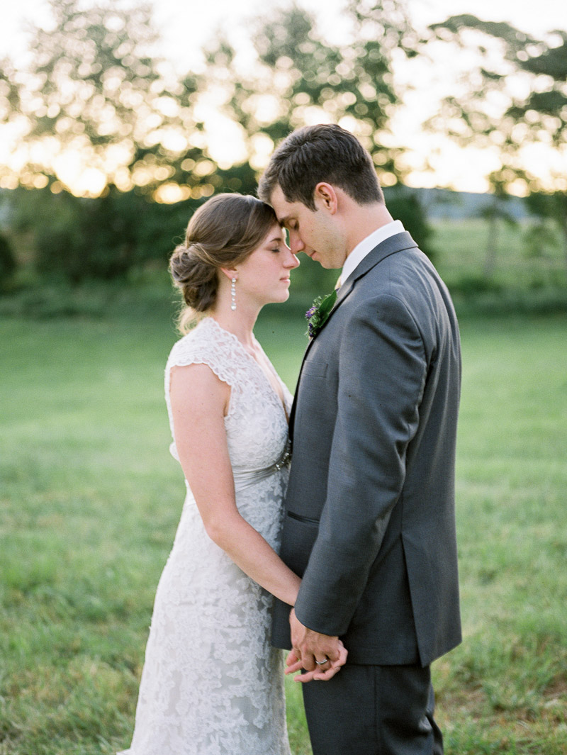 bride and groom embrace during a virginia sunset - fuji 400h - captured by Jordan Baker Photography at wolftrap farms