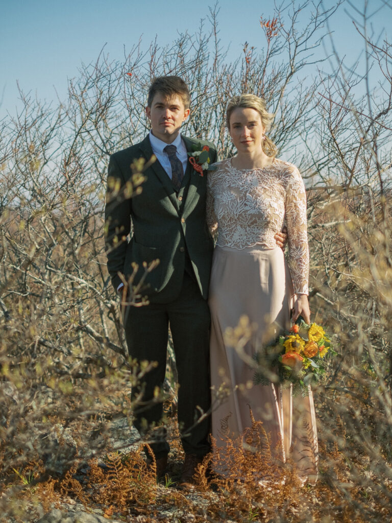 bride and groom in serious pose - sunrise wedding in Grayson Highlands - natural edit