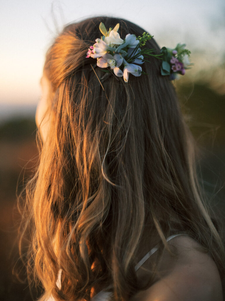 bride hair florals lit by sunset - Shenandoah National Park elopement