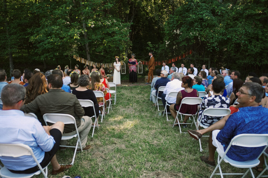 wide angle view of summer outdoor wedding ceremony in Virginia - film look 160C Virginia documentary wedding photographer