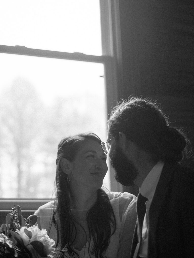 black and white photo of bride and groom in Haines chapel