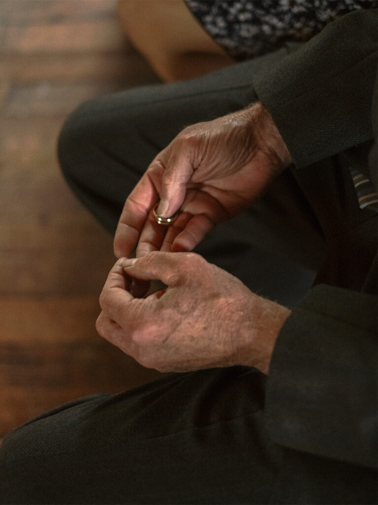 wedding rings being passed around the crowd for blessing at Haines chapel, Virginia