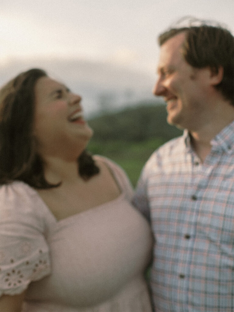 engagement session couple laughing blurry photo - big meadows Virginia at sunset - natural edit film based fuji160C