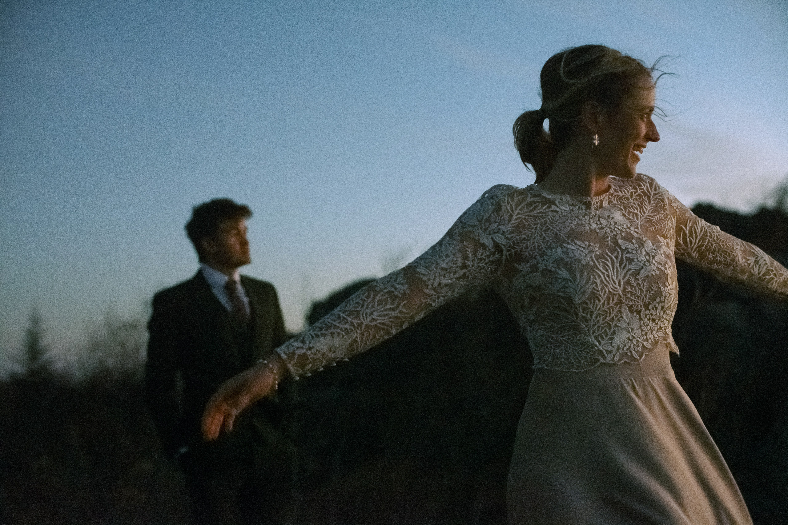 bride watching the sunrise before getting married in Grayson Highlands State Park - captured by Virginia documentary wedding photographer - fujifilm classic wedding photo